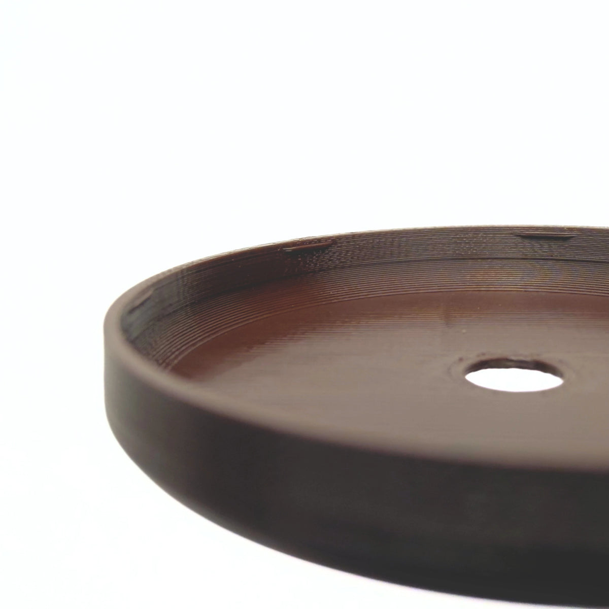 Coque marron ébène pour capteur FreeStyle Libre 2, vue macro du dessous