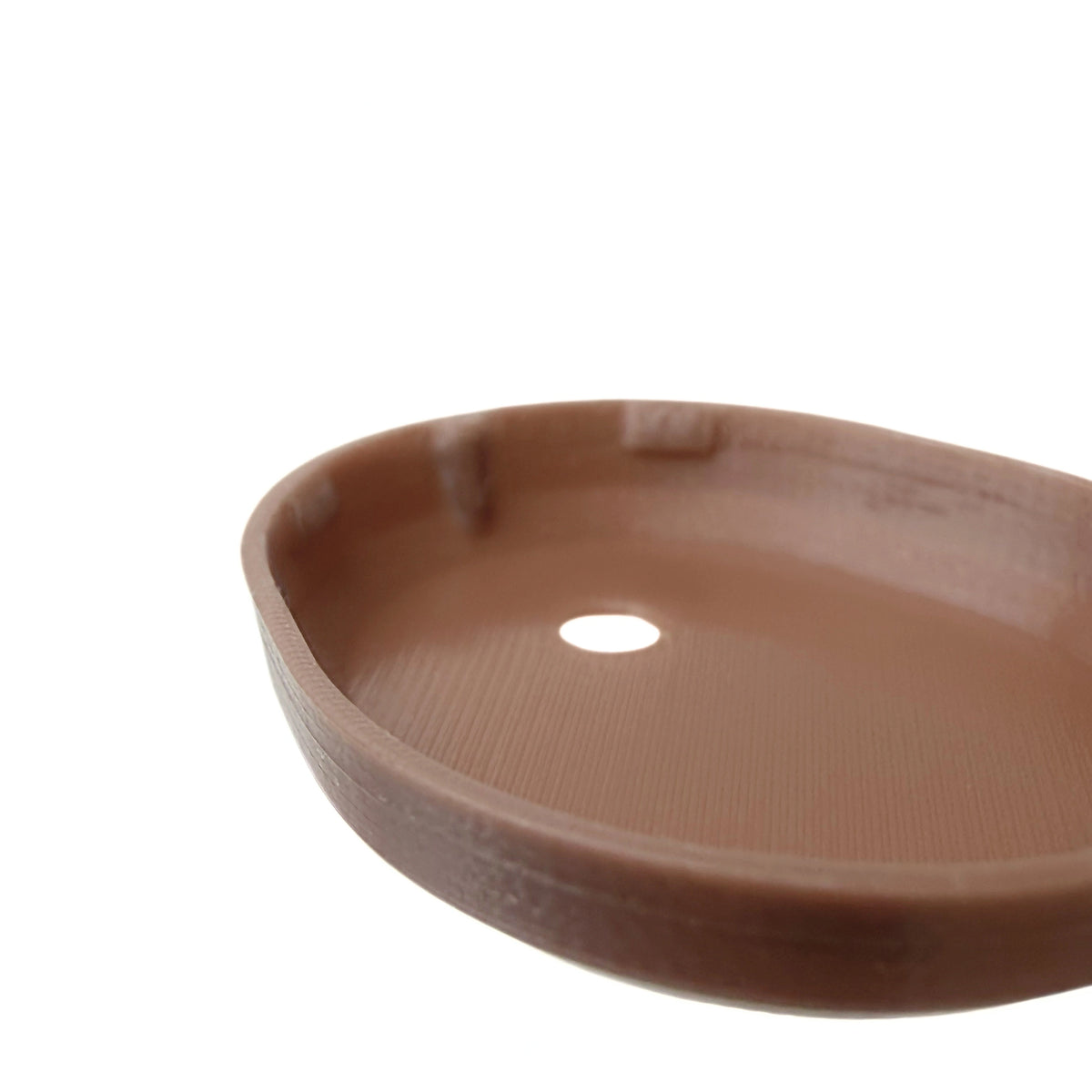 Coque marron foncé pour capteur Dexcom G7, vue macro du dessous